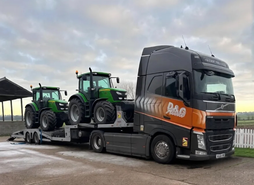 D&G truck transporting two tractors